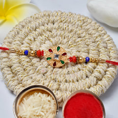 Round Rakhi With Green And Red Mina And Diamond With Effete Assorted Chocolate 96Gm ,Silver Color Pooja Coin, Roli Chawal & Greeting Card