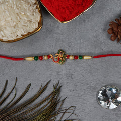 Om Rakhi With Morpichh With Decorative Baby Buddha Gift ,Silver Color Pooja Coin, Roli Chawal & Greeting Card