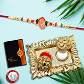 Ganesh Rakhi With Beads And Mina With Square Pooja Thali Set ,Silver Color Pooja Coin, Roli Chawal & Greeting Card