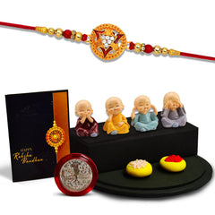Round Rakhi With Trangal In Middle With Decorative Baby Buddha Gift ,Silver Color Pooja Coin, Roli Chawal & Greeting Card