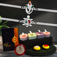 Ganesh And Turtle Silver Color Rakhi With Decorative Gift 4Pc Diya Set ,Silver Color Pooja Coin, Roli Chawal & Greeting Card