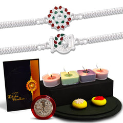 Flower And Mor Silver Color Rakhi With Decorative Gift 4Pc Diya Set ,Silver Color Pooja Coin, Roli Chawal & Greeting Card