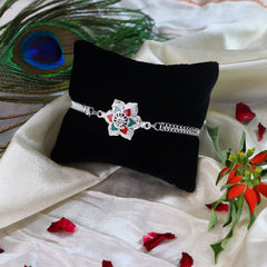 Ganesh Golden Color Rakhi And Silver Flower Rakhi With Decorative Gift 4Pc Diya Set ,Silver Color Pooja Coin, Roli Chawal & Greeting Card