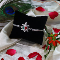 Ganesh And Turtle Silver Color Rakhi With Decorative Gift 4Pc Diya Set ,Silver Color Pooja Coin, Roli Chawal & Greeting Card