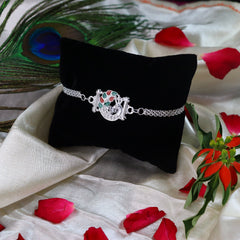 Flower And Mor Silver Color Rakhi With Decorative Gift 4Pc Diya Set ,Silver Color Pooja Coin, Roli Chawal & Greeting Card