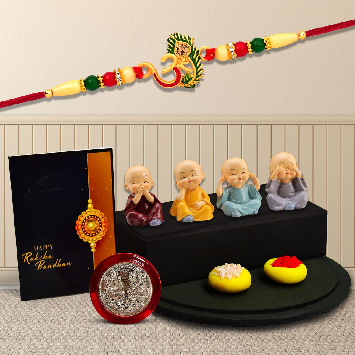 Om Rakhi With Morpichh With Decorative Baby Buddha Gift ,Silver Color Pooja Coin, Roli Chawal & Greeting Card