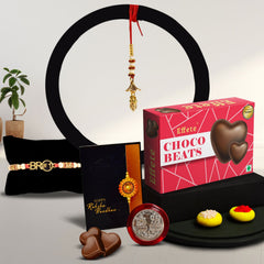 Red & Blue Mina With Diamond And Beads Rakhi With Effete Choco Beats Chocolate 32Gm ,Silver Color Pooja Coin, Roli Chawal & Greeting Card