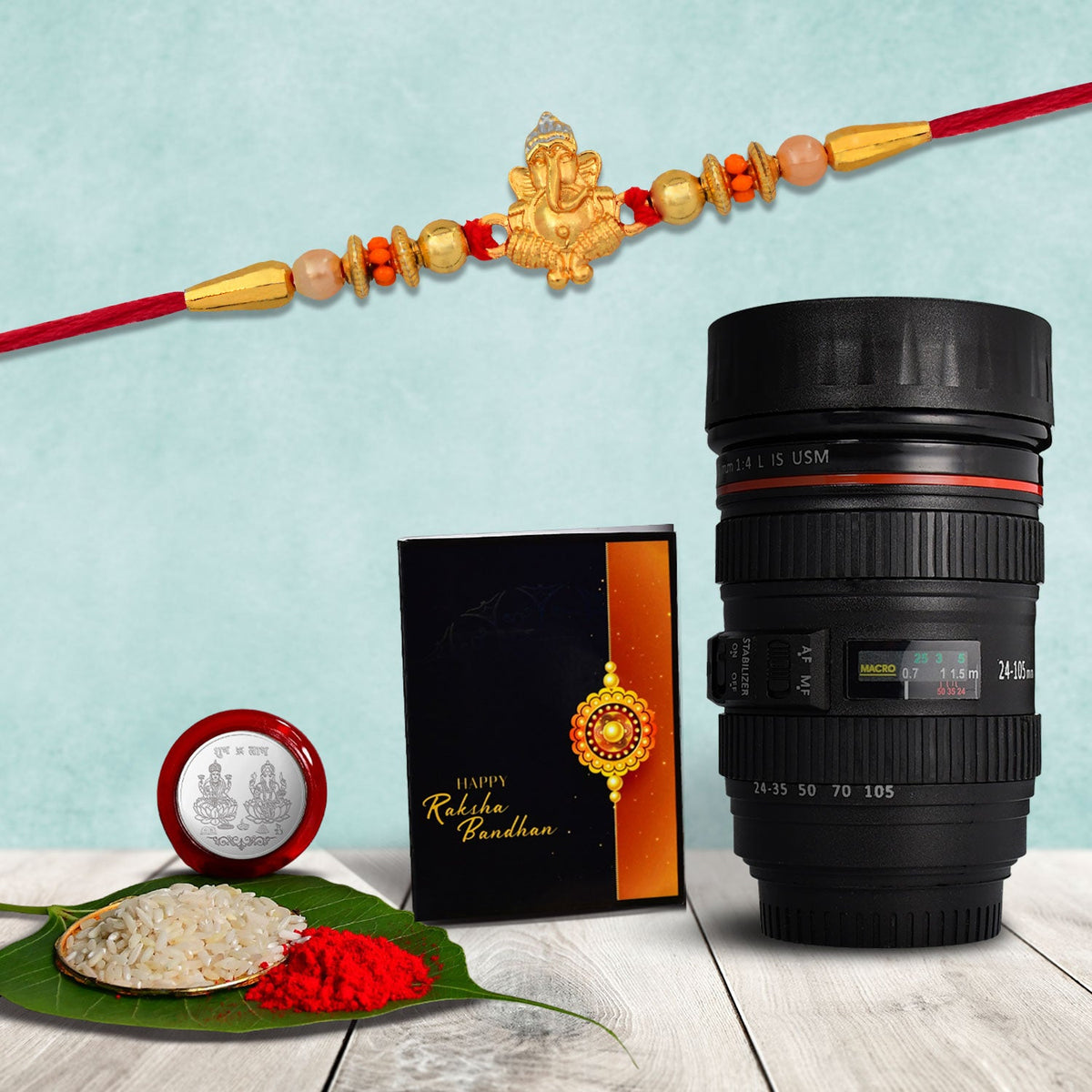 Ganesha Rakhi With Beads Work With Coffee Camera Lense Mug ,Silver Color Pooja Coin, Roli Chawal & Greeting Card
