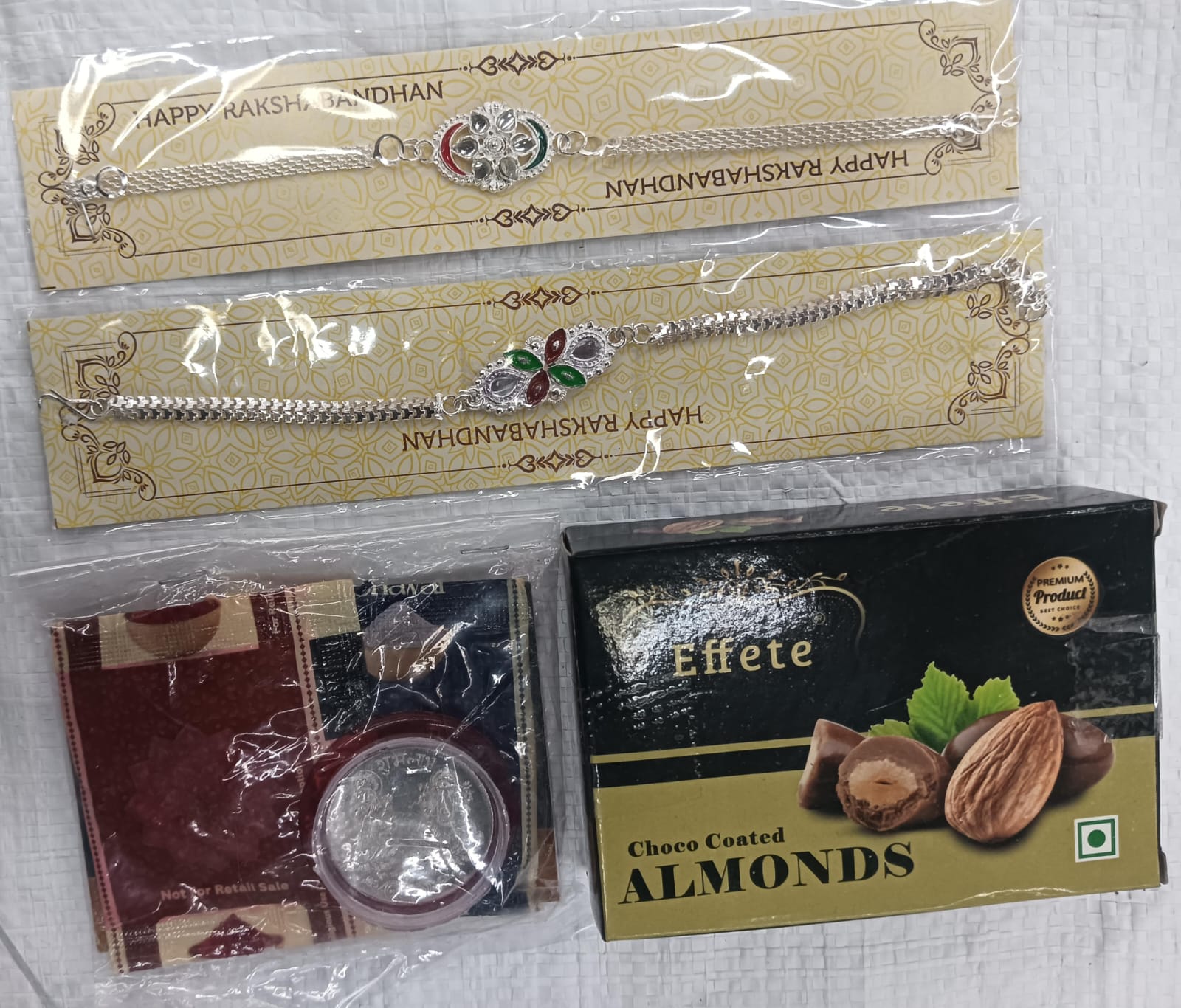 Designer Rakhi Set with Almond Chocolates, Roli-Chawal, Coin & Greeting Card – Raksha Bandhan Gift Combo